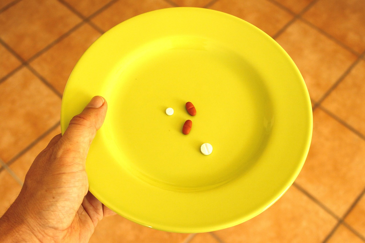Pill, plate, pills — illustrating Cagrilintide: The Amylin Analog, Explained