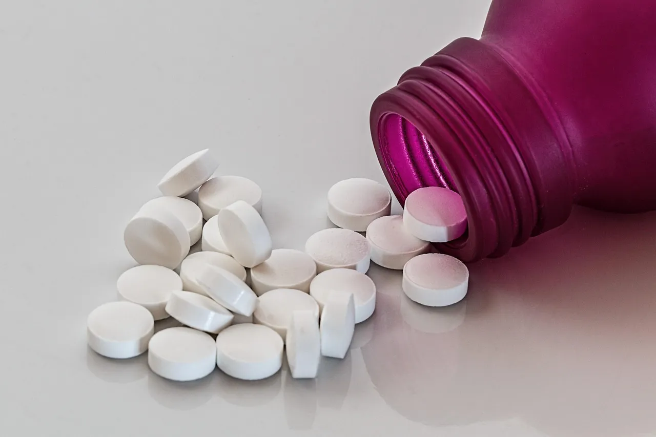 Shelves of labeled medication bottles in a pharmacy dispensary