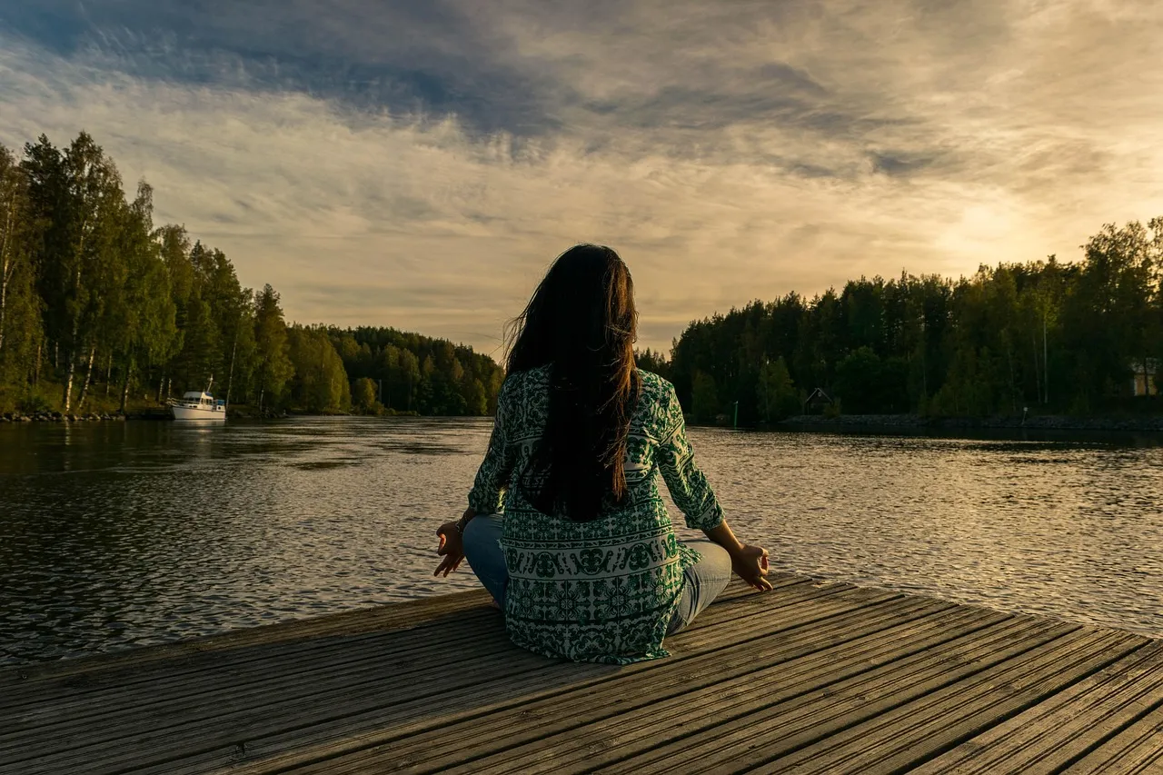 Yoga, woman, lake — illustrating Creatine for Brain and Cognitive Aging