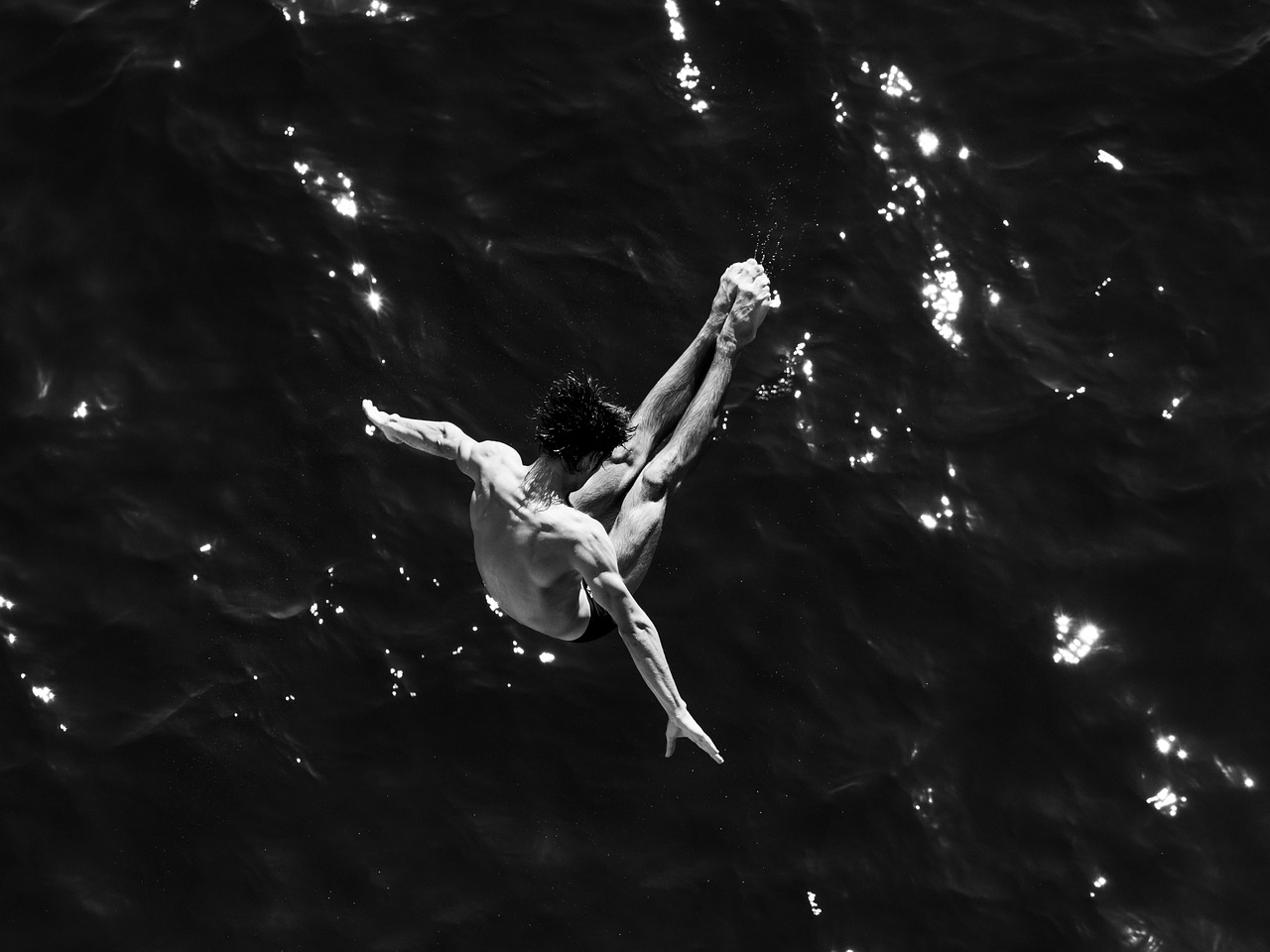 Man, dive, jump — illustrating Does Cold Water Immersion Really Help?
