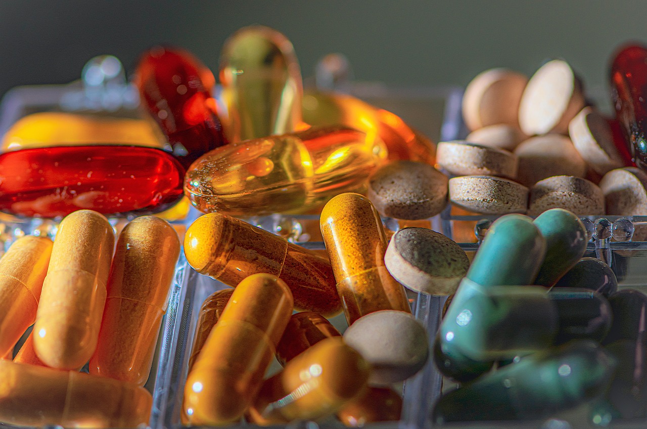 Vitamins, pills, pharmacy — illustrating GLP-1 vs Growth-Hormone Peptides: Different Goals, Different Evidence