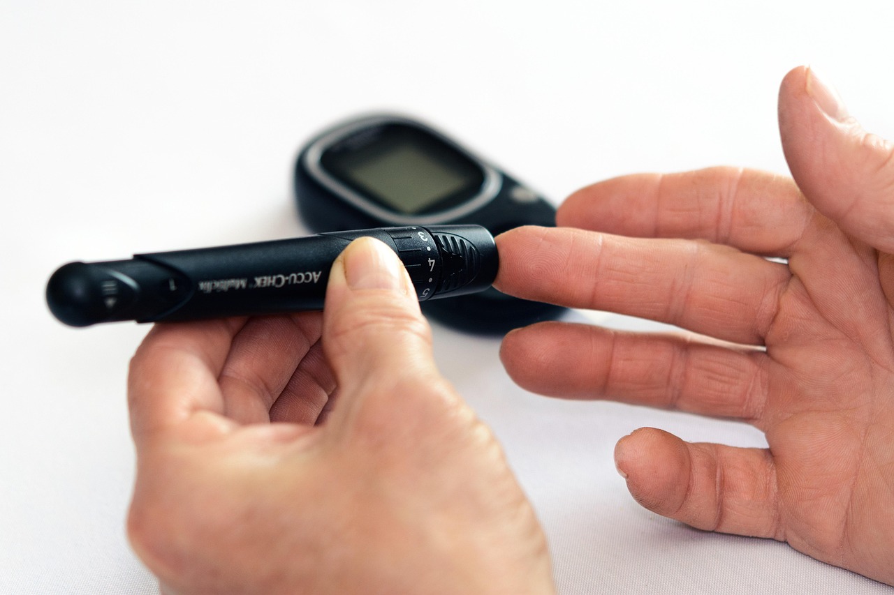 The level of sugar in the blood, the meter, hand — illustrating How to Read an Insulin Syringe for Peptides