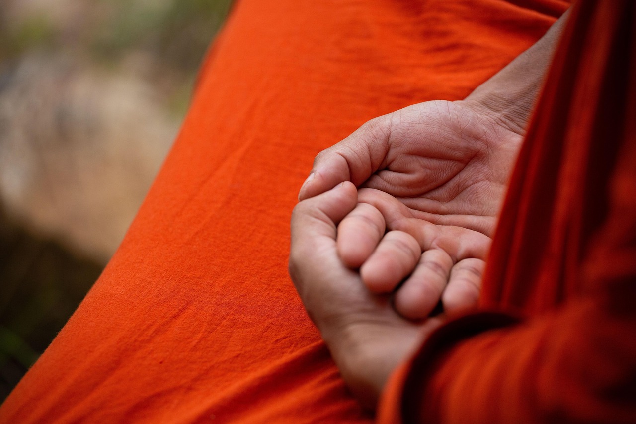 Monk, meditation, hands — illustrating Mobility and Stretching for Recovery