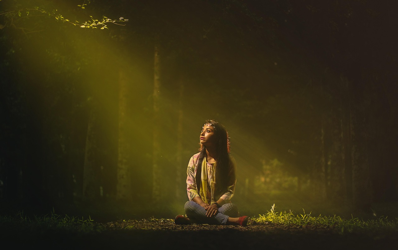 Woman, sitting, sunlight — illustrating Mobility and Stretching for Recovery