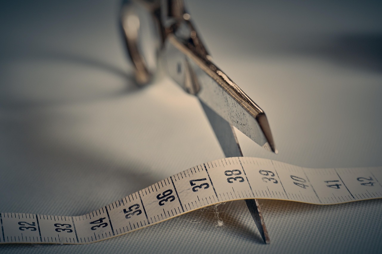 Scissors, tape measure, measurement — illustrating ‘“Ozempic Face”: Facial Aging and Rapid Fat Loss’