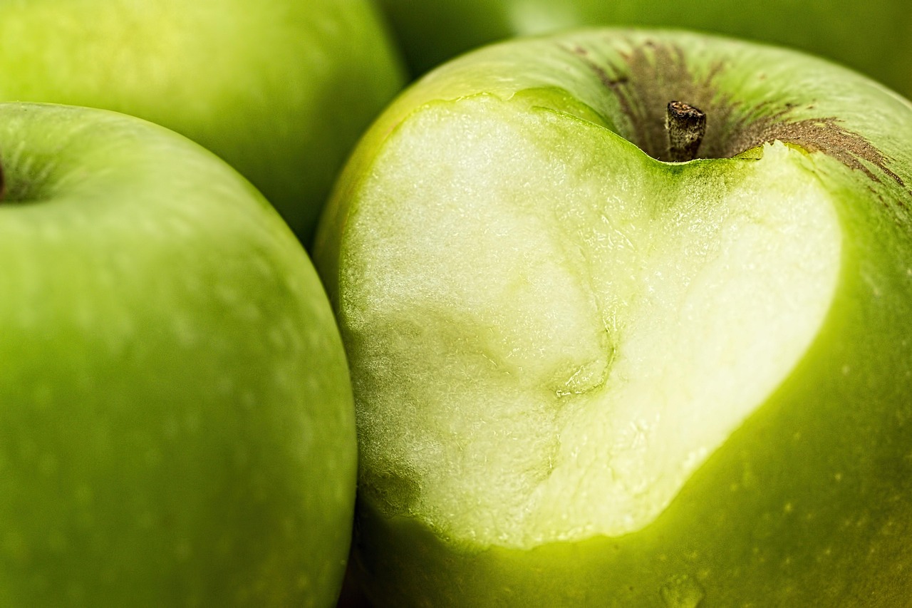 Green apple, bite, food — illustrating Semaglutide and Tirzepatide Titration Schedules: When to Step Up