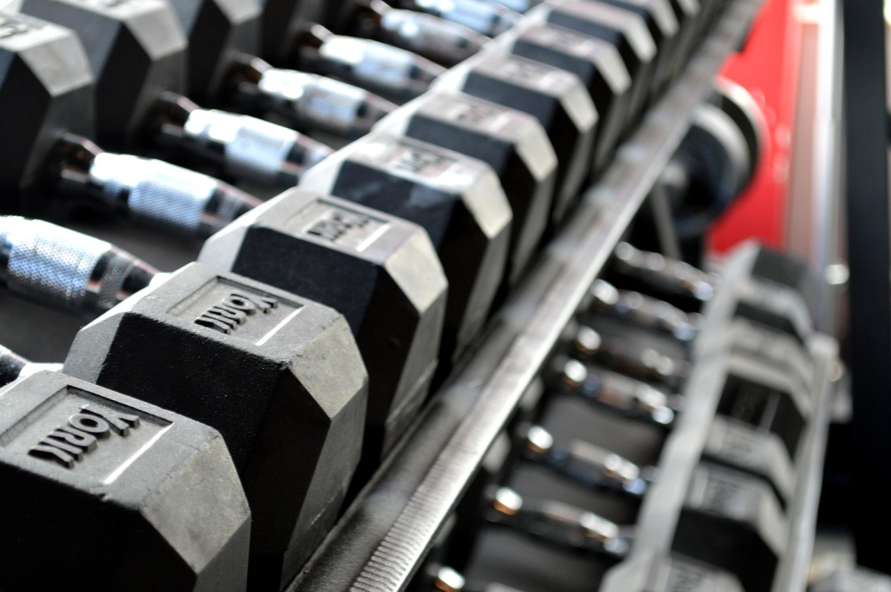 Fitness, weight lifting, dumbbells — illustrating Tendinopathy Rehab: What Actually Works