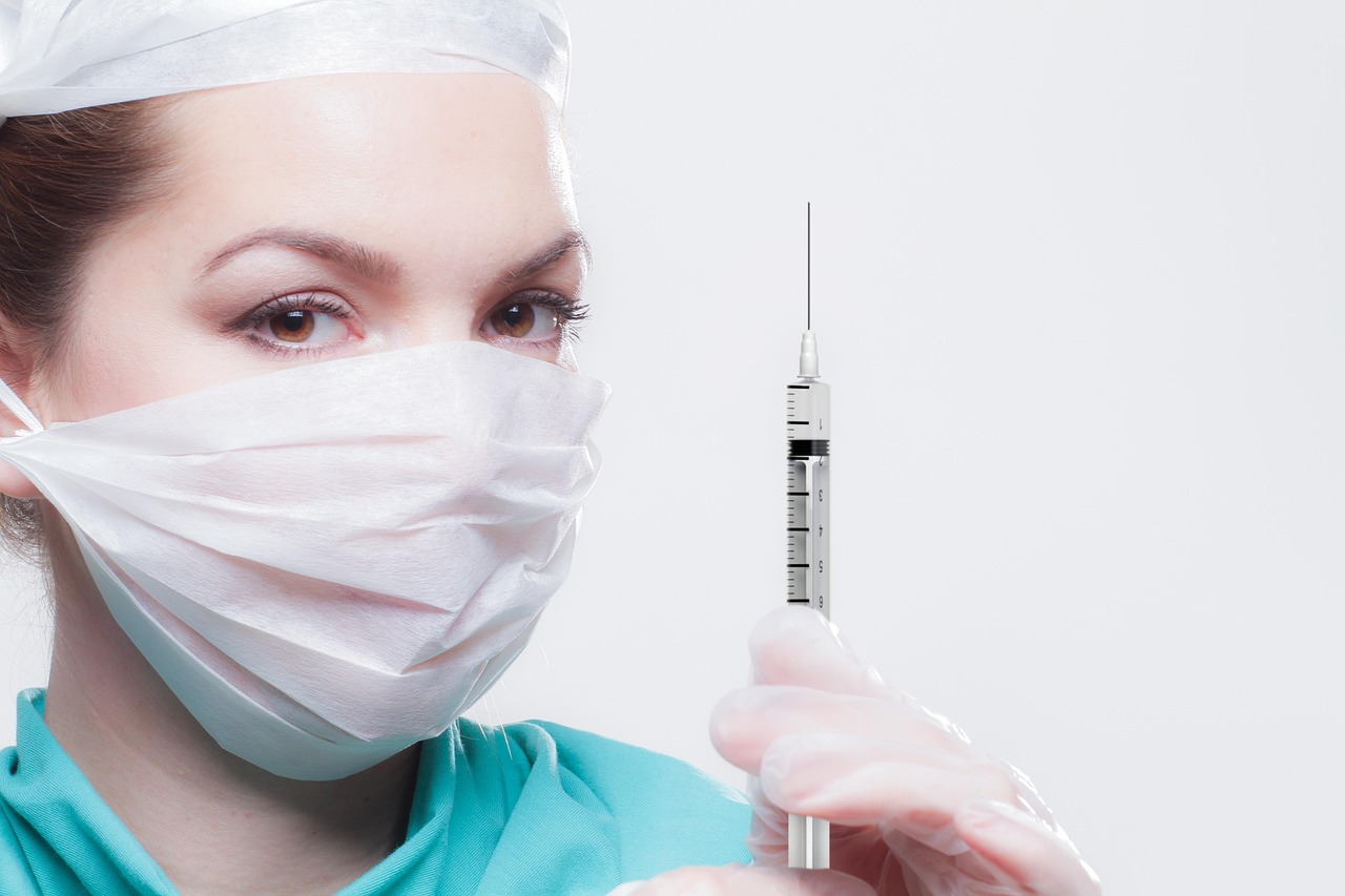Woman, healthcare professional, syringe — illustrating Tesofensine: Appetite, Weight, and the Open Questions