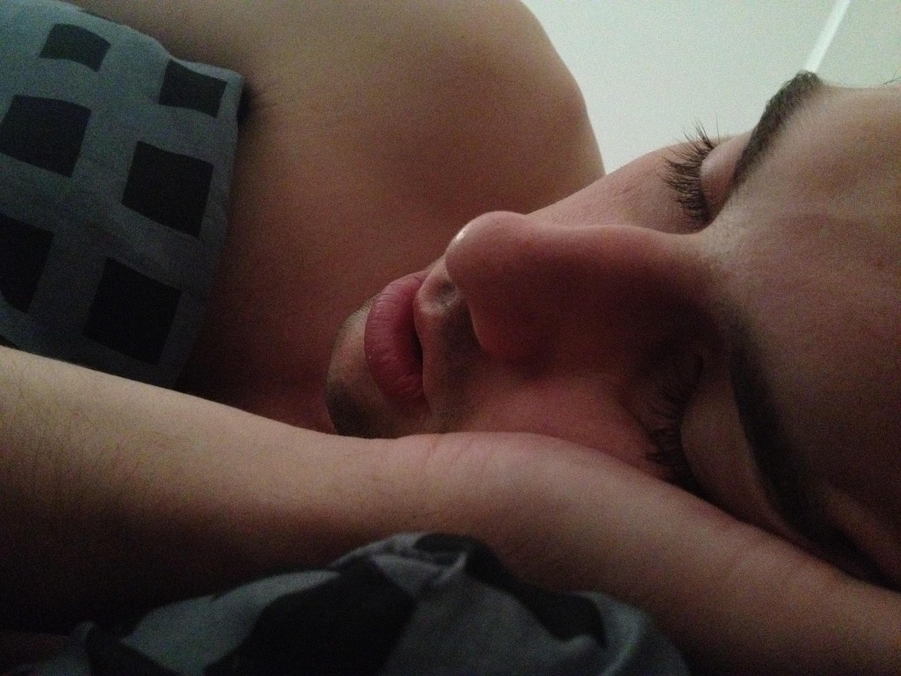 Sleeping time, man, bedroom — illustrating The Role of Light in Circadian Recovery