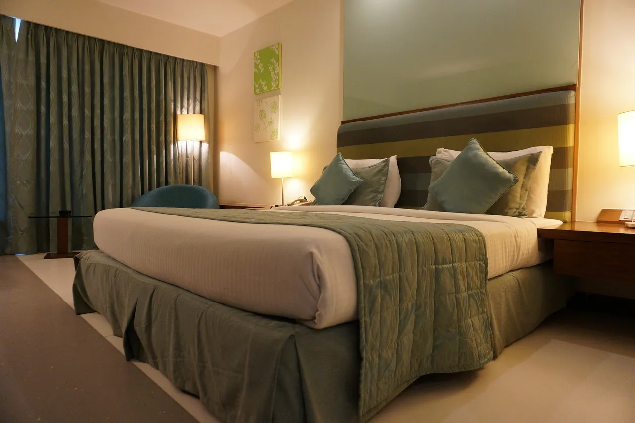 Hotel, room, bed — illustrating The Science of Sleep Stages and Repair