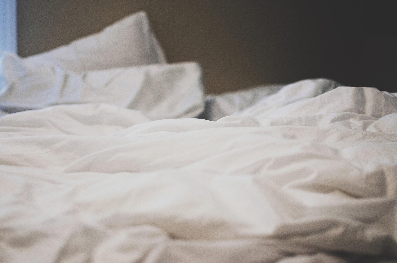 Bed, sheets, pillows — illustrating Why Sleep Beats Every Recovery Gadget