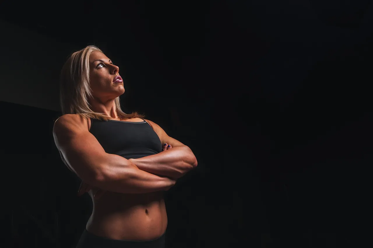 Training, arms, blonde — illustrating GLP-1s and Muscle: The Complete Guide to Protecting Lean Mass